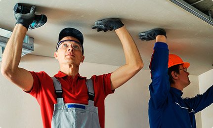 Professional elevator installation team at work